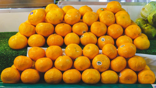 Close-up of oranges for sale in market stall