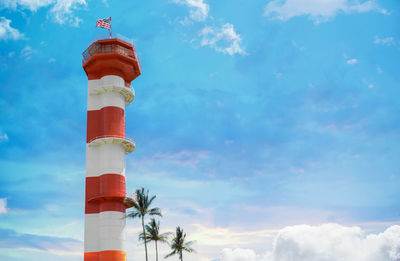 Low angle view of lighthouse against blue sky