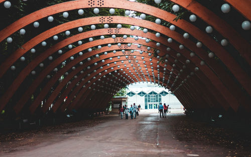 People walking in corridor of building