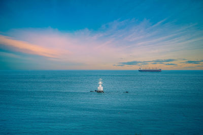 Scenic view of sea against blue sky