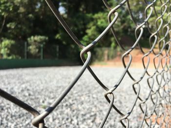 Close-up of metal fence against blurred background