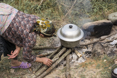 High angle view of person preparing food on rocks