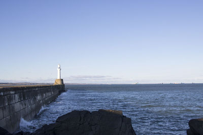 Scenic view of sea against clear sky