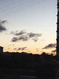 Silhouette trees against sky during sunset