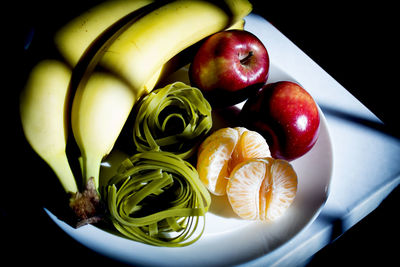 High angle view of apples in plate on table