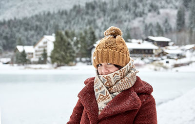 Winter portrait of an attractive young woman looking at camera.