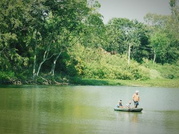 People in boat on lake