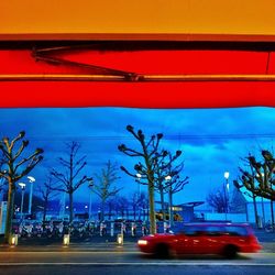 View of illuminated street light against sky at sunset