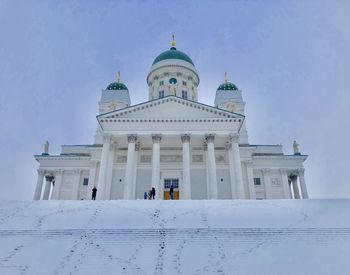 Low angle view of a snowy helsinki cathedral, located in kruununhaka, helsinki, finland. 