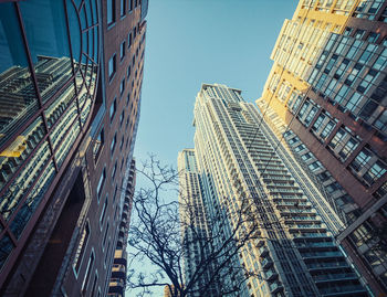 Low angle view of modern buildings against clear sky