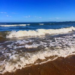 Scenic view of beach against clear sky