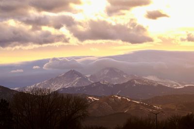 Scenic view of mountains against sky at sunset