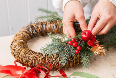 Midsection of woman holding christmas tree