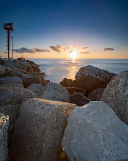 Scenic view of sea against sky during sunset