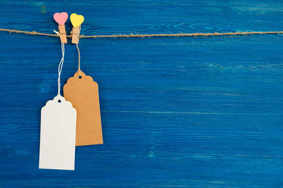 High angle view of paper hanging on table