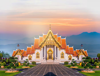 View of temple building against sky during sunset