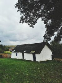House on field against sky