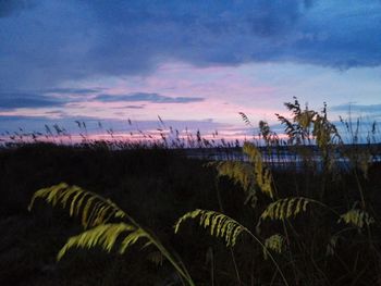 Scenic view of lake against cloudy sky