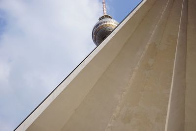 Low angle view of building against cloudy sky