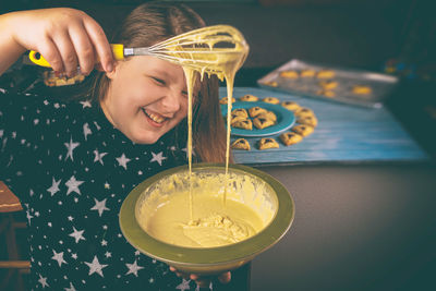 Portrait of a smiling girl holding ice cream