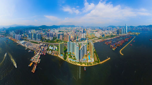 High angle view of city buildings against sky