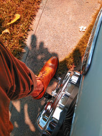 Low section of man sitting on motorcycle