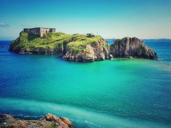 Scenic view of sea against clear blue sky