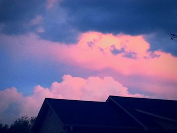 High section of house against cloudy sky