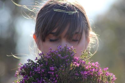 Close-up of woman holding flowers