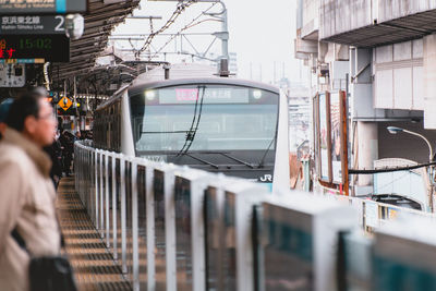 People on train in city