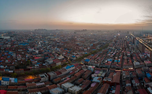 High angle view of cityscape against sky during sunset