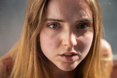 Close-up high angle portrait of young woman outdoors