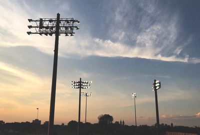 Low angle view of silhouette street light against sky during sunset