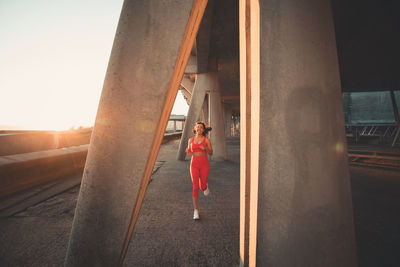 Woman running on sunny day