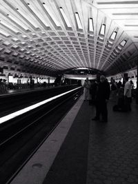 People at railroad station platform