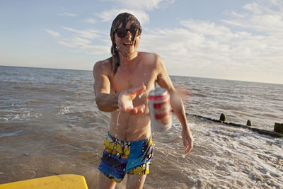 Young man hanging out on a beach