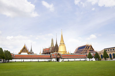 View of temple building against cloudy sky