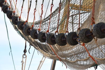 Low angle view of fishing net against clear sky