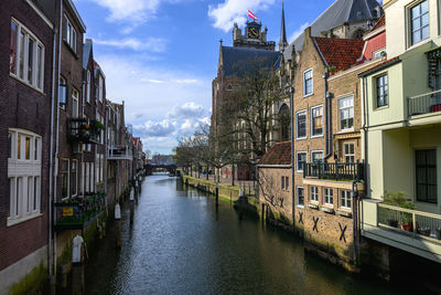 Canal amidst buildings in city