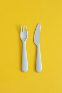 Food plastic packaging on yellow background. concept of recycling plastic and ecology.