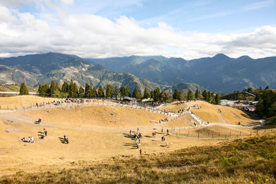 Scenic view of landscape and mountains against sky