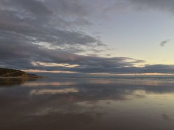 Scenic view of lake against sky during sunset