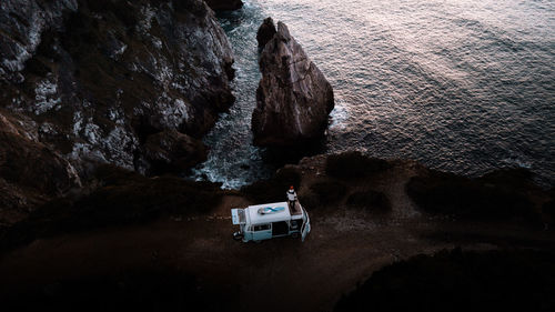 High angle view of rocks on sea shore