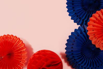 Close-up of red flower against white background