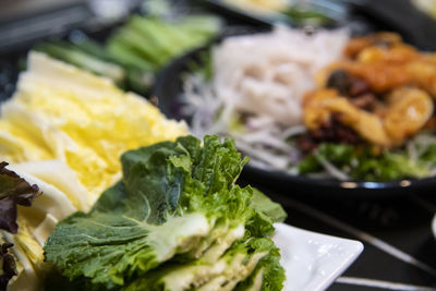 Close-up of chopped vegetables and seafood in plate