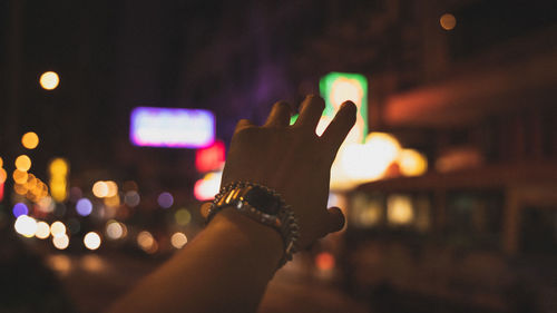 Cropped hand of man gesturing outdoors