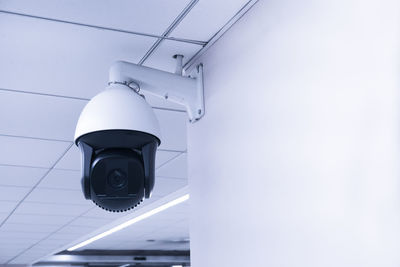 Low angle view of electric lamp on wall