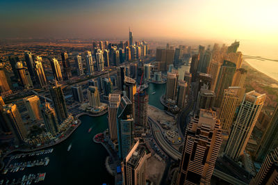 High angle view of buildings against sky during sunset