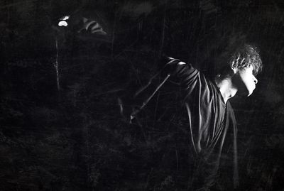 Woman standing at night