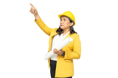 Full length of man wearing hat standing against white background